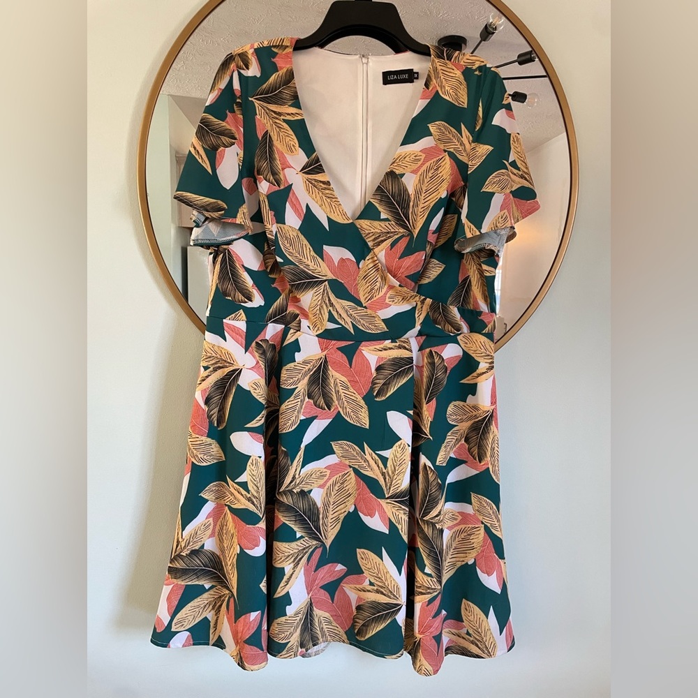 Liza Luxe 1X dress with pockets. Teal/yellow/peach leafy design. Wrap look top